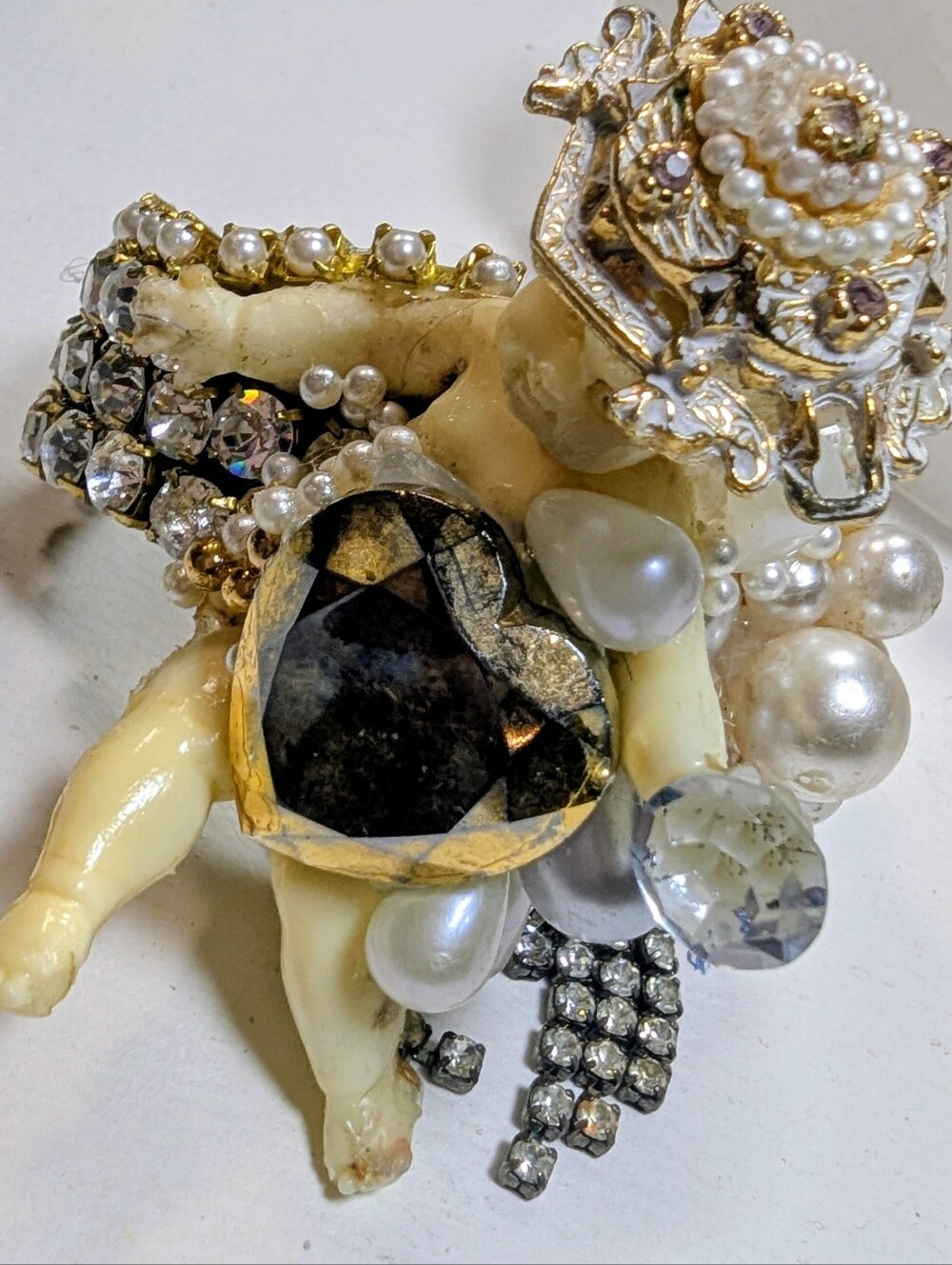 Wendy Gell cherub cuff with gold heart and dangles.